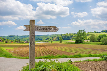 Signpost labeled with rifle association&rsquo;s clubhouse (Schuetzenhaus)