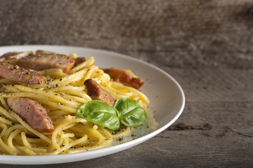 Spaghetti carbonara on white plate