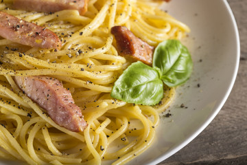 Spaghetti carbonara on white plate