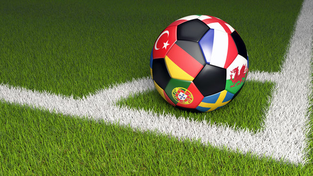 Bunter Fu&szlig;ball mit Nationalflaggen der Teams der EM 2016. Eckball auf gr&uuml;nem Rasen.