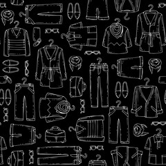 Vector seamless pattern with hand drawn isolated clothing for men on black color.  Pattern on the theme of  fashion