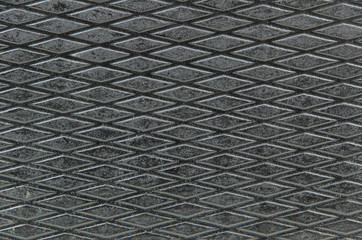closeup of the diamond shaped pattern on a surface of the music mixer case