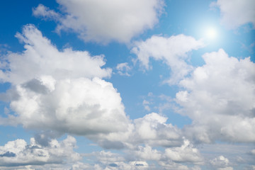 Fototapeta na wymiar Beautiful cloudscape with sun over horizon.