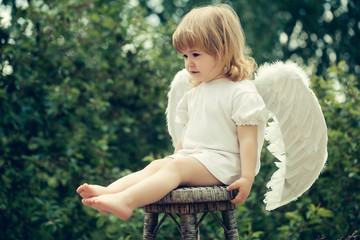 Little boy dressed as angel