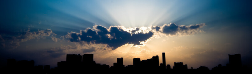 city silhouette at sunset panorama photo.