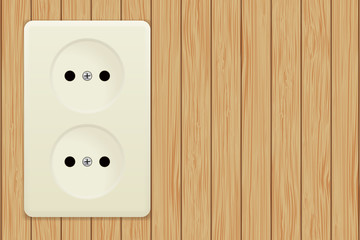 Electric socket on wooden background