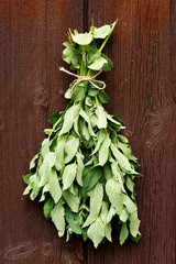 Mint drying on a wooden background 