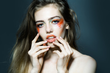 Girl with orange makeup closeup