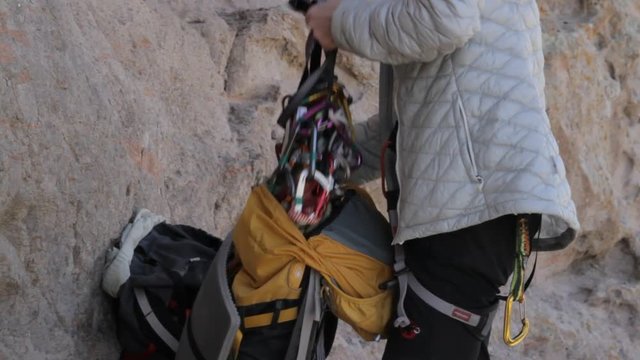 Climbers equipment placed in a backpack after the passage of a rocky route