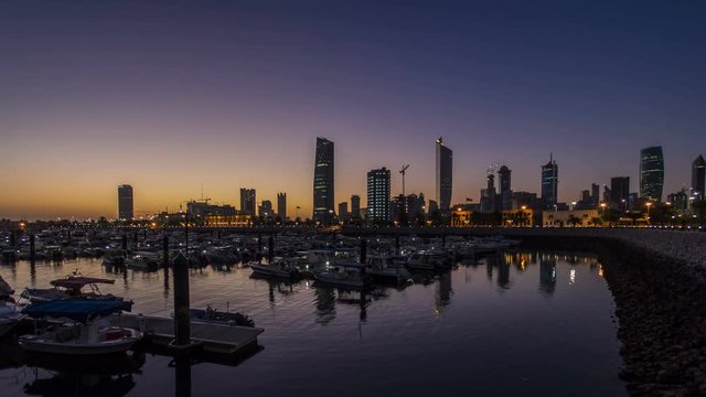 Yachts and boats at the Sharq Marina night to day timelapse in Kuwait. Kuwait City, Middle East