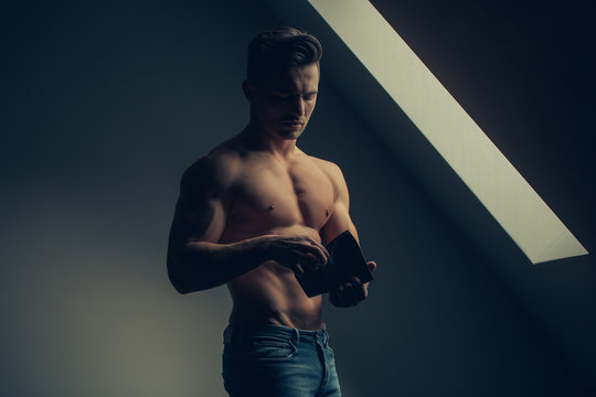 Sexy muscular man with wallet