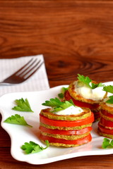 Grilled zucchini with chopped fresh tomatoes, yoghurt and green parsley. Squash vegetarian recipes. Easy summer appetizer. Simple snacking for summer. Delicious vegetable food. Closeup
