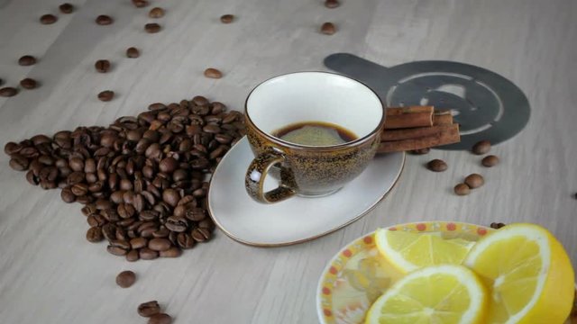 Coffee beans and coffee cup on table with lemon. 20ml Ristretto 30ml Espresso 60ml Doppio 90ml Lungo