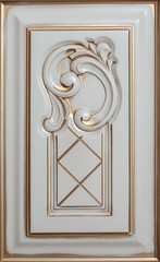 element woodcarving. furniture in classic style. white tree with gold trim. patina. carving. small depth of field. luxury furniture.