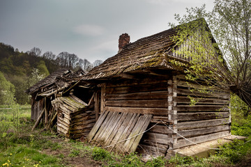 Old ruined house with collapsed roof