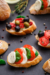 Bruschetta with tomatoes, mozzarella and basil