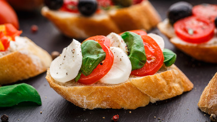 Bruschetta with tomatoes, mozzarella and basil