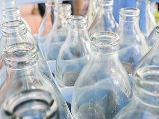 more empty bottle in crates