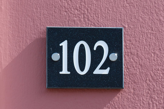 House Number 102 sign