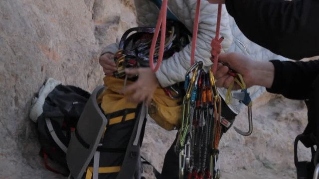 Climbers equipment placed in a backpack after the passage of a rocky route