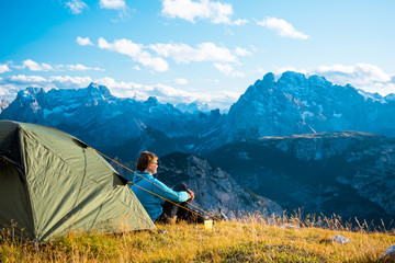sportsman in high mountains camping