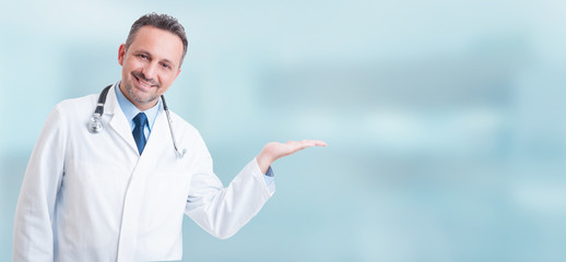 Young positive medic holding something in his palm