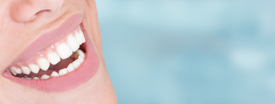 Closeup of perfect healthy smile of young woman