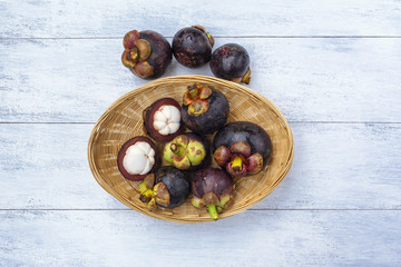 Fresh Mangosteen from Thailand in the bamboo basket 
