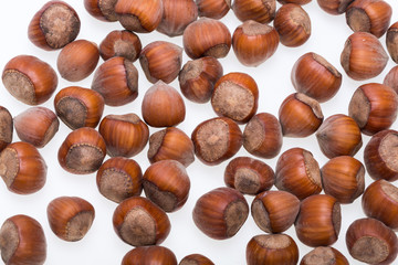 Pile of hazelnuts isolated on white background