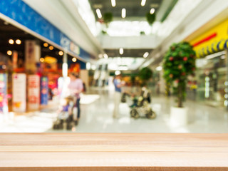 Wooden empty table in front of blurred background