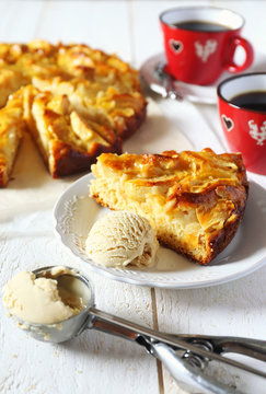Apple pie, ice cream and cups of coffee