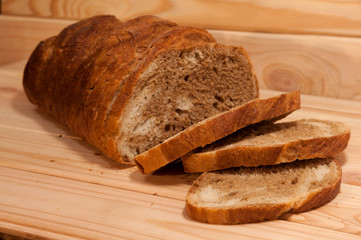 marble sliced ​​wheat - rye bread on a wooden board