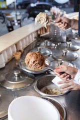 Workers Holding Spatulas With Chocolate And Butterscotch