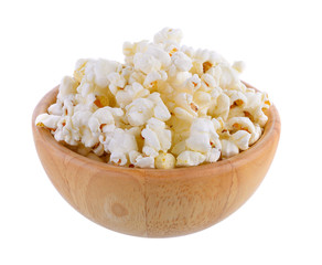 popcorn in wood bowl isolated on white background