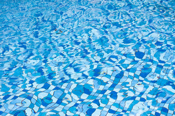 25 May 2016, Hotel swimming pool with sunny reflections, Swimming pool of luxury hotel, Swimming pool and wooden deck ideal for backgrounds