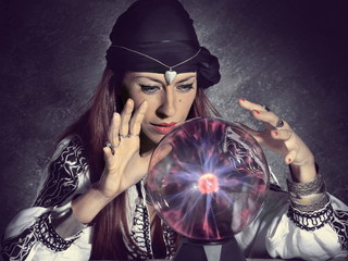 gypsy fortune teller forecasting future with crystal ball