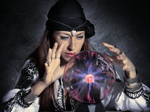gypsy fortune teller forecasting future with crystal ball
