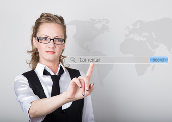 Car rental written in search bar on virtual screen. Internet technologies in business and home. woman in business suit and tie, presses a finger on a virtual screen