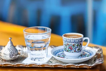 Keuken spatwand met foto traditional oriental nougat with turkish coffee on a wicker tray © alimyakubov