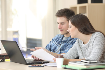 Girl studying and teaching another student