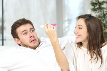 Scared man with positive pregnancy test