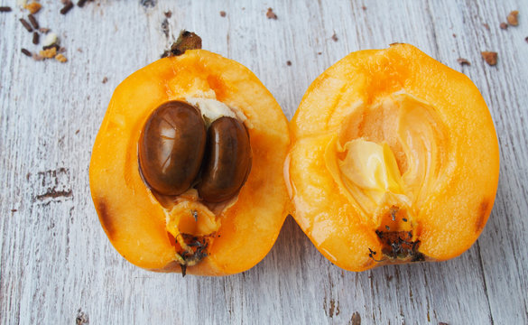 Loquat Medlar fruit on wooden  background