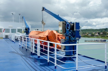 Cranes and life boats on ferry boat