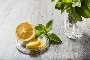 The cut lemon on a glass stand