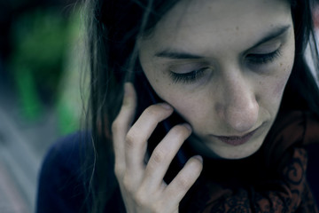 Young Sad Woman Talking On Phone