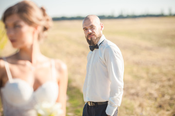 Groom looking at his bride