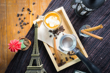 Top view coffee with cinnamon, anise and cane sugar and Paris mo