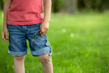 Cute little boy with the hand cuffs on his hands