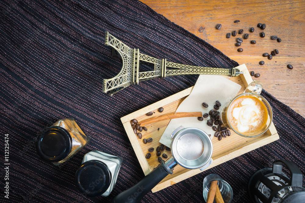 Wall mural top view coffee with cinnamon, anise and cane sugar and paris mo