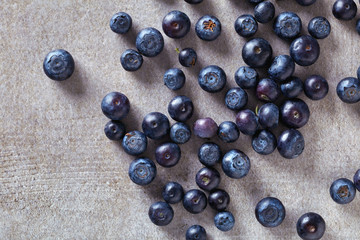 Ripe blueberry on stone table. from above